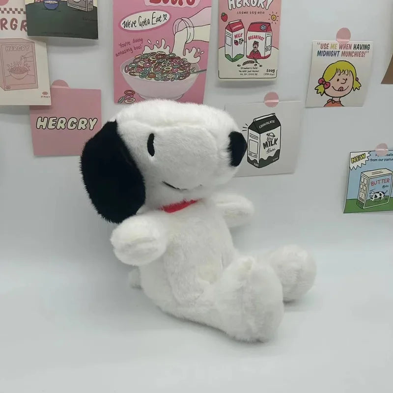 Snoopy plush toy being hugged, showing its cuddly size and softness