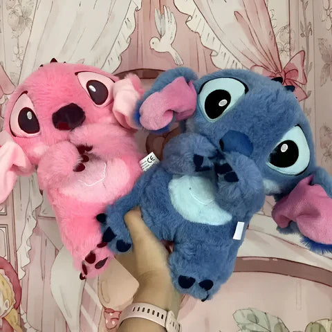 Child sleeping peacefully beside the Stitch breathing plush toy
