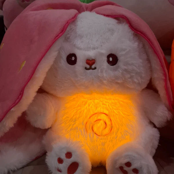 Close-up of strawberry radish bunny plush glowing with light