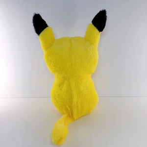 Pikachu breathing plush toy back view with black ears on a white background 