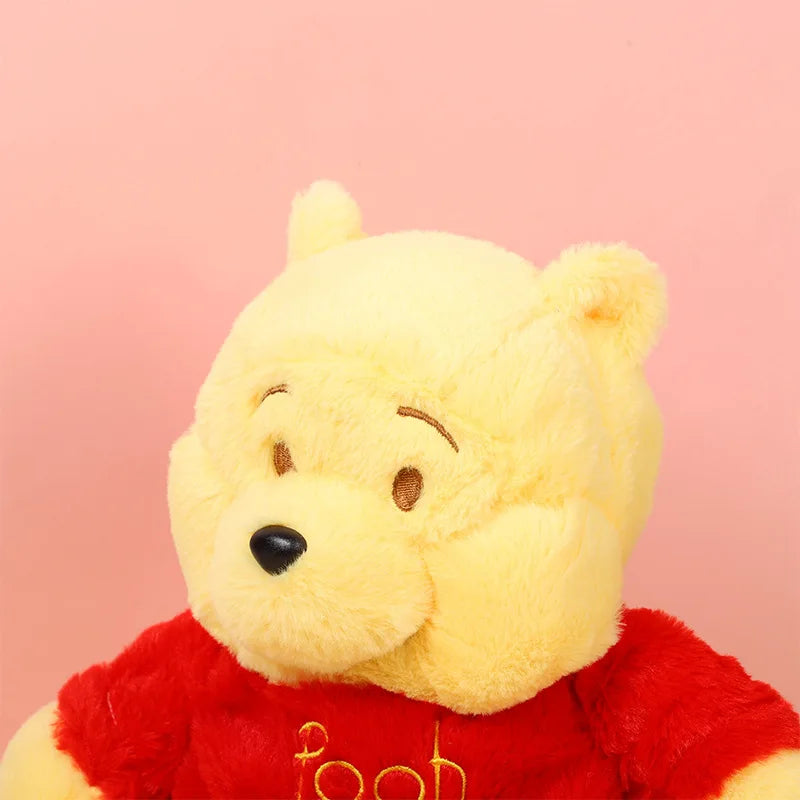 Close-up of Winnie the Pooh breathing plush showing its soft fabric and gentle motion