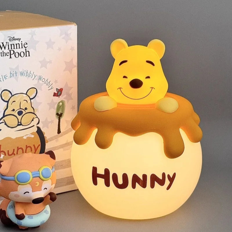 Winnie the Pooh night light displayed on a bedside table with a warm glow